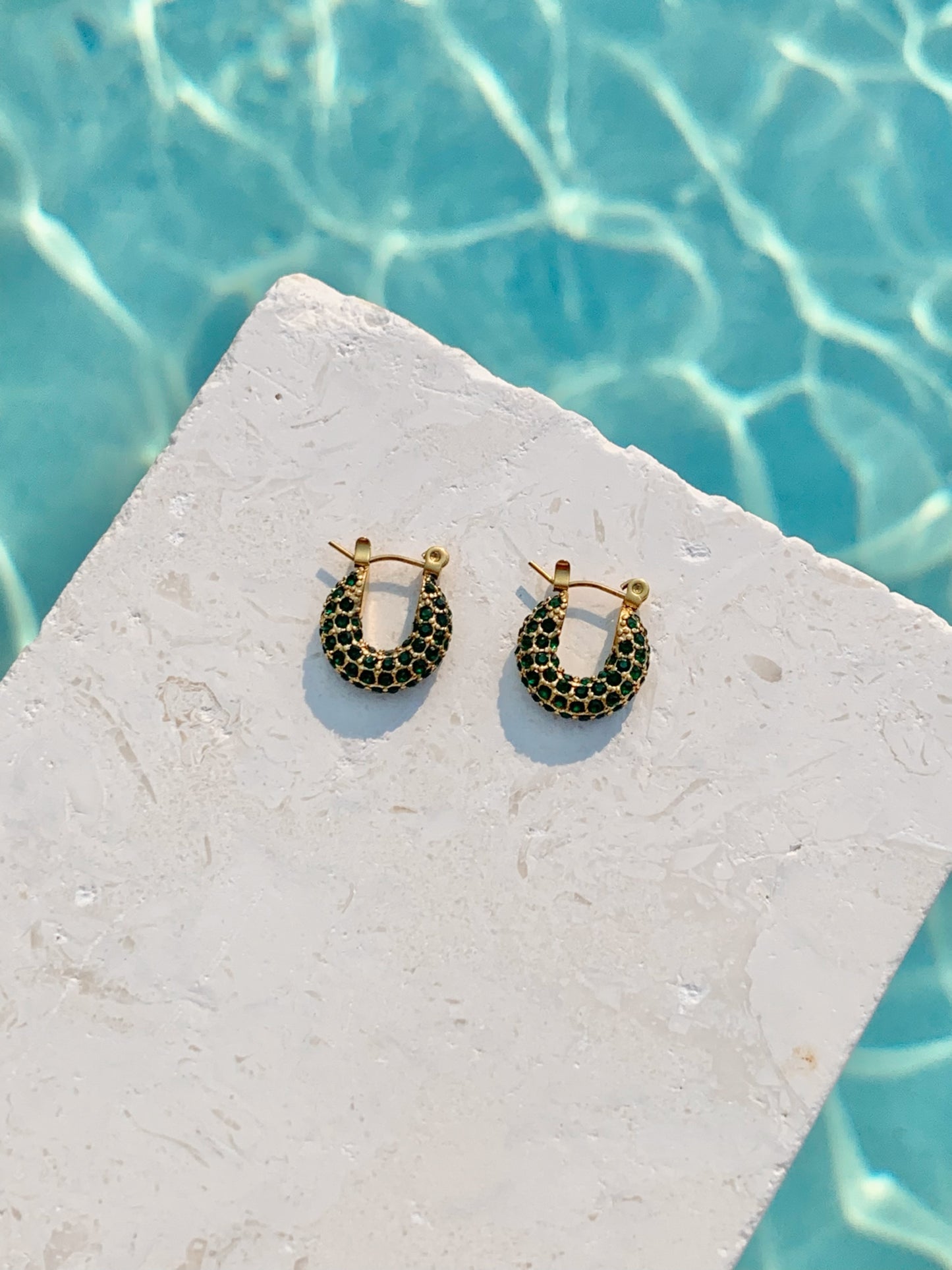 TIANI GREEN HUGGIE HOOP EARRINGS