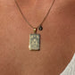 Necklace with a pendant on a person's neck