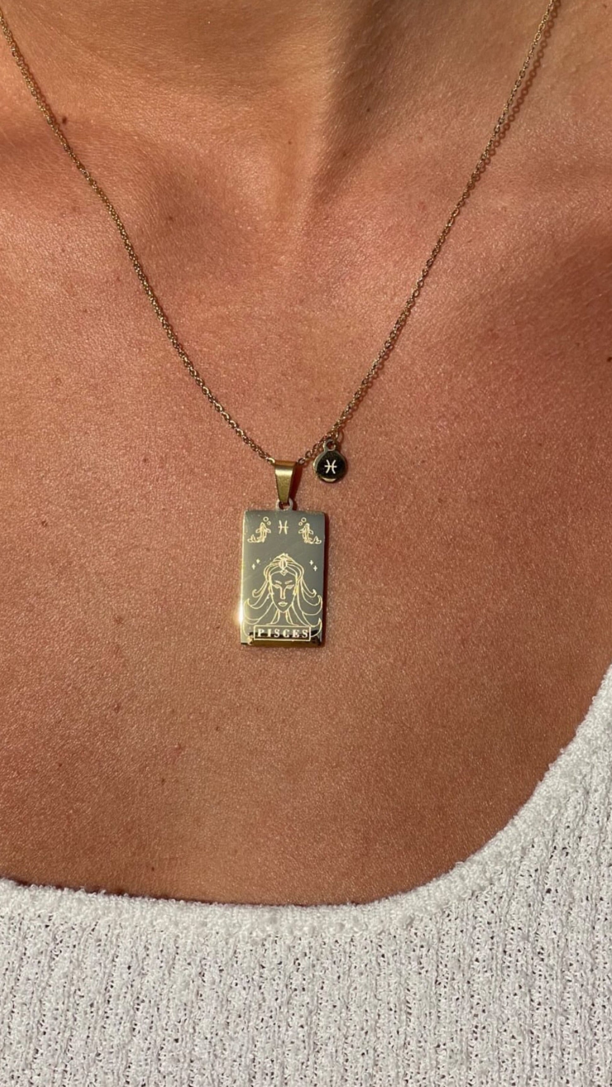 Necklace with a pendant on a person's neck