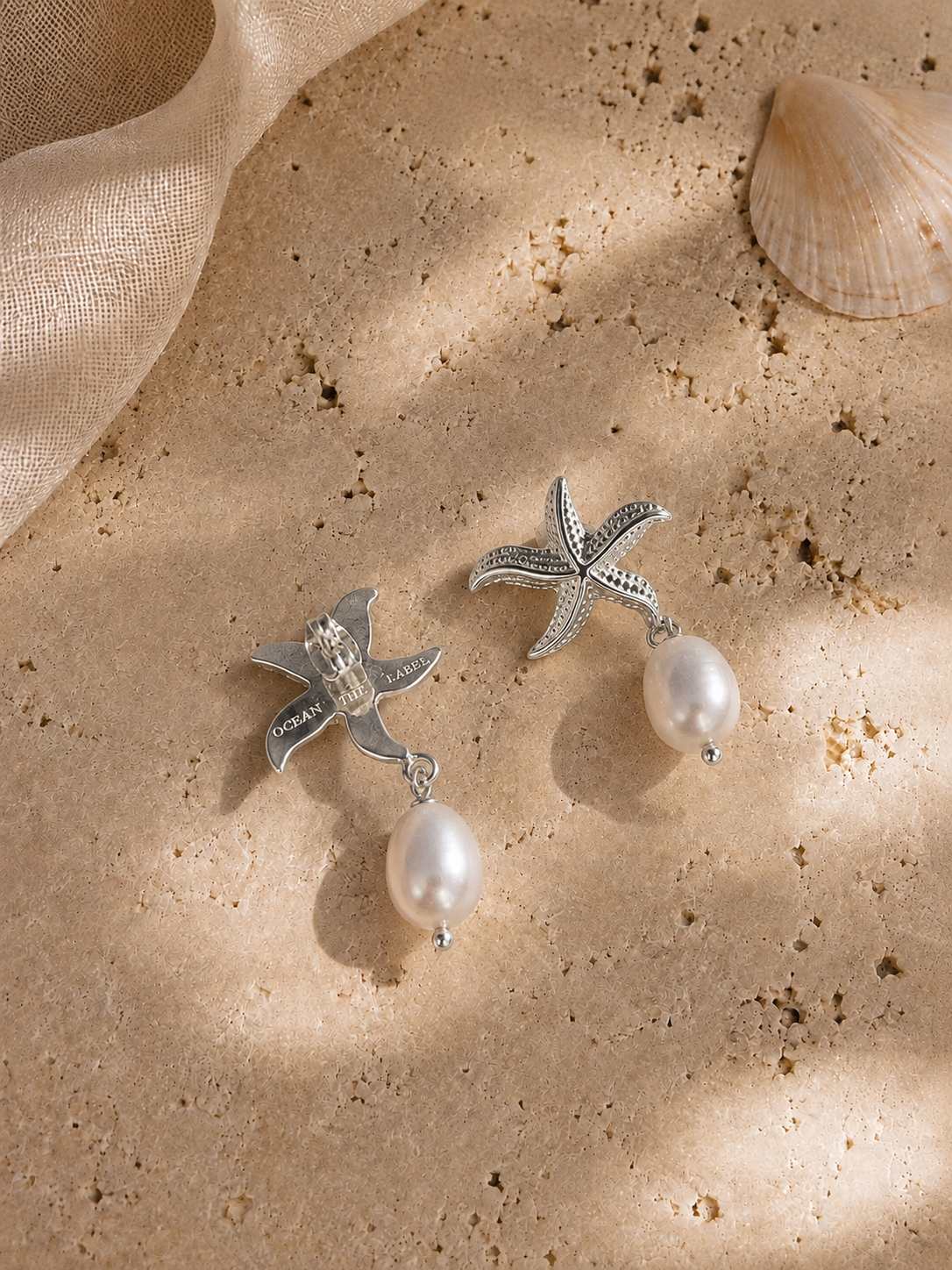 Back view of the Maris silver starfish earrings showing the earring fastening and detailed construction