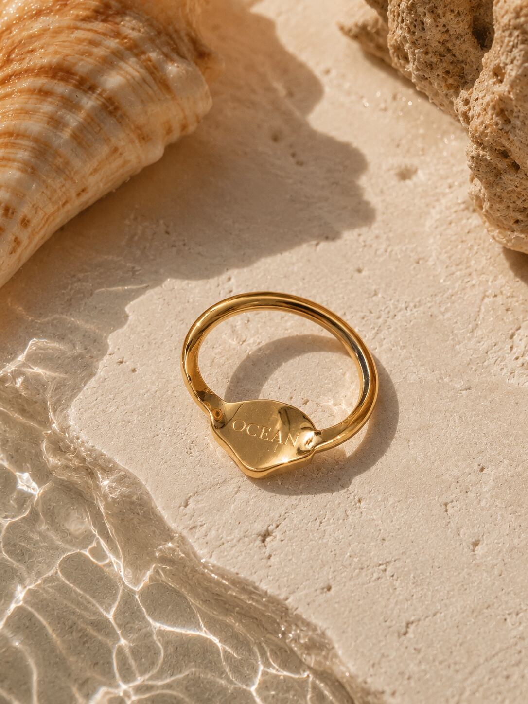 A shell ring with engraving of OCEAN inside