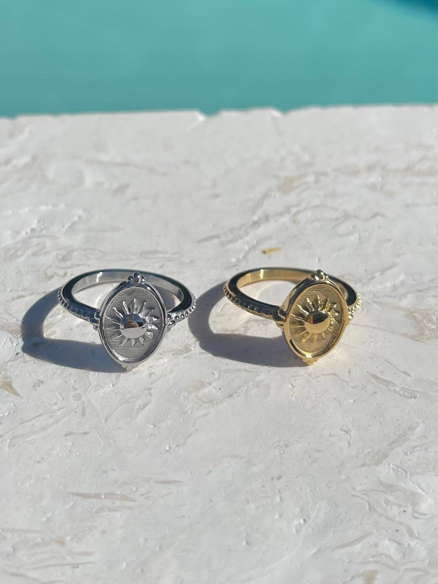 Two oval sun rings, one silver-toned and one gold-toned, waterproof jewellery elegant designs 