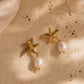Close-up of the Maris gold starfish and pearl earrings worn on the ear, highlighting the intricate gold detailing